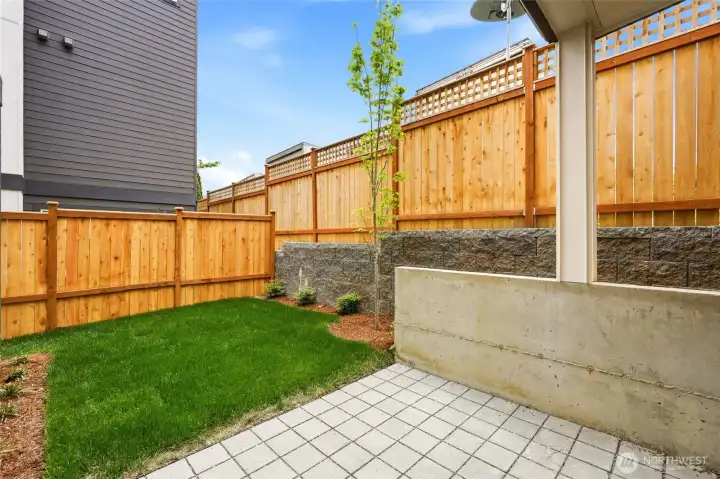 fenced yard space and patio