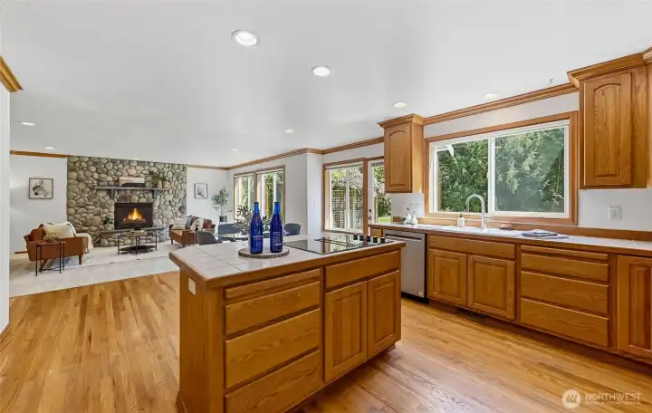 Expansive kitchen seamlessly connects to the family room and features ample cabinetry