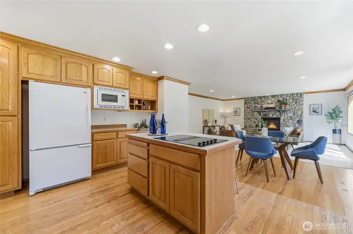 Expansive kitchen seamlessly connects to the family room and features ample cabinetry.