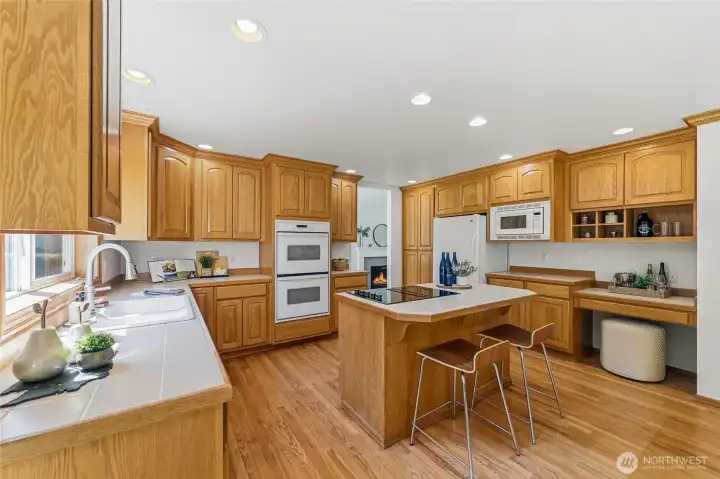 Thoughtfully designed kitchen offers a double oven, providing convenience for large meals and special events.