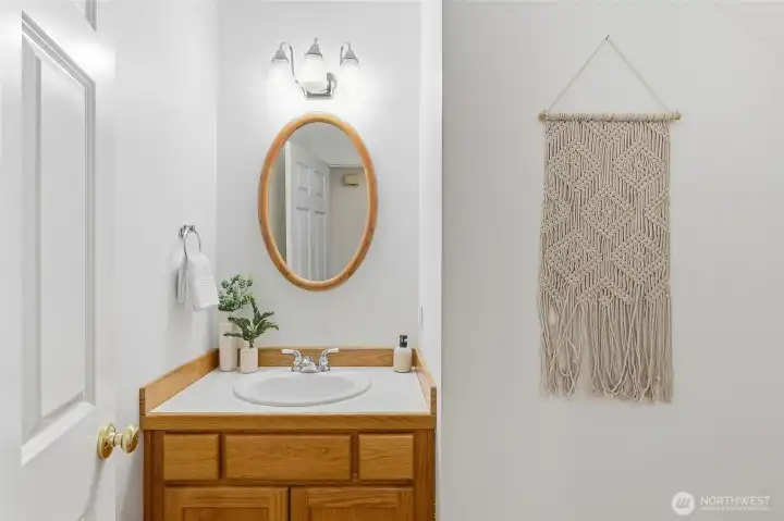 Charming main floor powder room. New PEX plumbing added throughout the home!