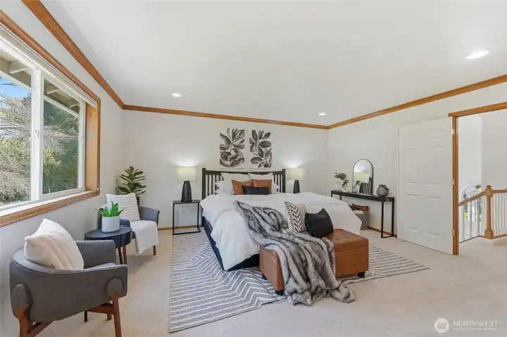 Stylish double French doors provide a welcoming entry to the primary suite.
