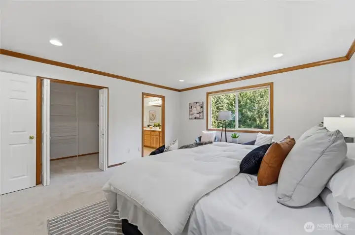 Spacious walk in closet conveniently connected to the primary bedroom.