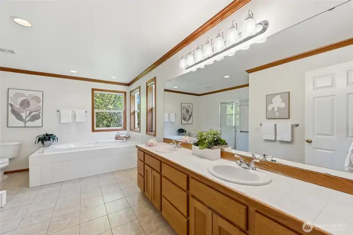 Primary suite is complemented by a well-appointed 5-piece en-suite bathroom.