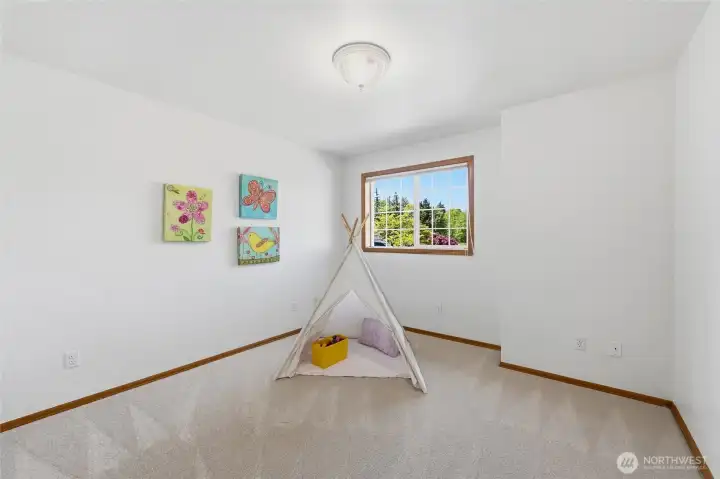 Second generously sized upstairs guest bedroom with a unique cutout which would be ideal for a study desk