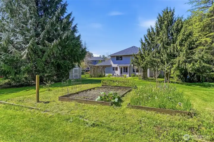 Raised vegetable garden area, thoughtfully designed and ideally located to soak in abundant sunshine - perfect for the dedicated gardener.