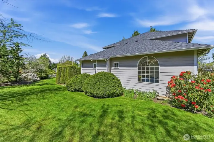 Generous side yard has ample space and is ready for your ideas. Sports court anyone?