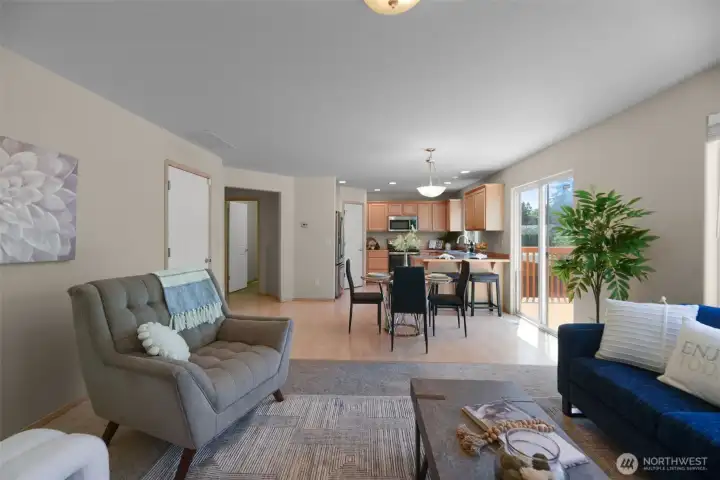 Living room open to dining and kitchen on main floor