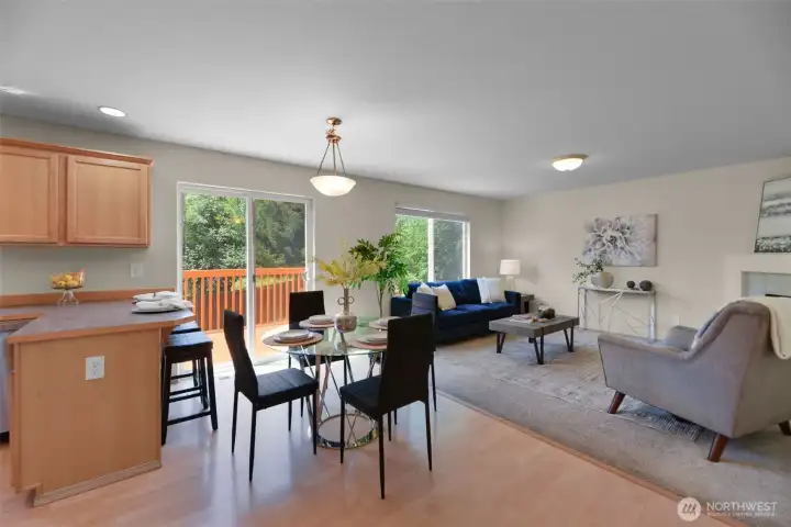 Dining area with slider to deck and fully fenced back yard.