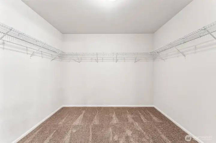 Primary WIC-Disclaimer- Photos are from a similar floor plan from another community, photos are for illustrative purposes only. Finishes, flooring, features, upgrades, countertops, paint, colors, and other features may vary.