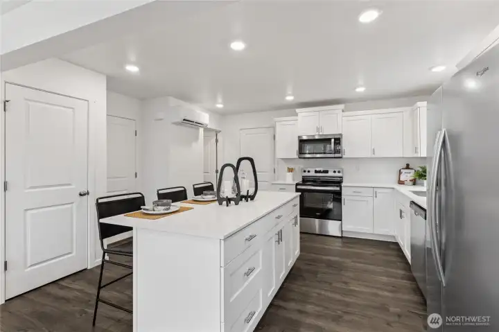 “Modern kitchen featuring quartz countertops and stainless steel appliances.” “Modern kitchen featuring quartz countertops and stainless steel appliances.”