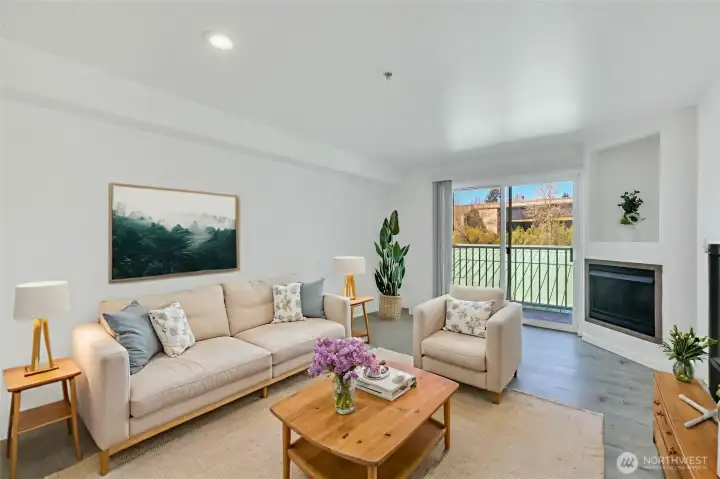 Living room with balcony and gas fireplace (HOA dues cover the gas). Virtually staged