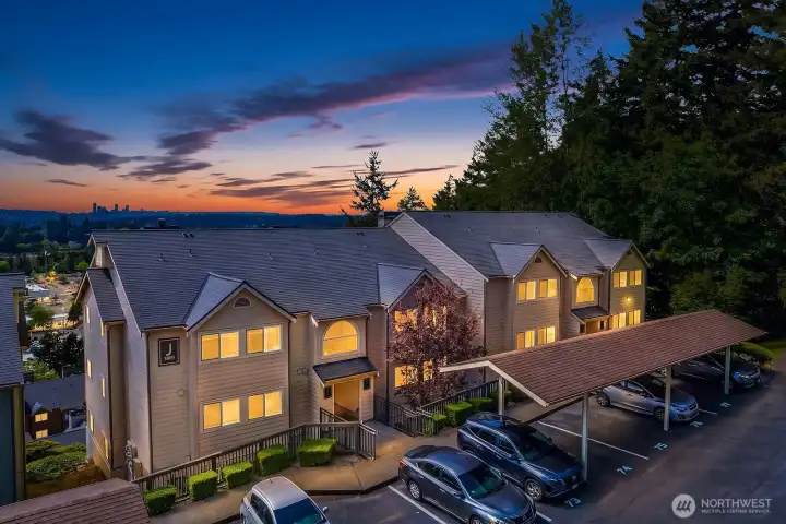 Aerial view of Sterling Heights community showcasing the well-maintained grounds, ample parking, and lush Pacific Northwest surroundings. Aerial view of Sterling Heights community showcasing the well-maintained grounds, ample parking, and lush Pacific Northwest surroundings.