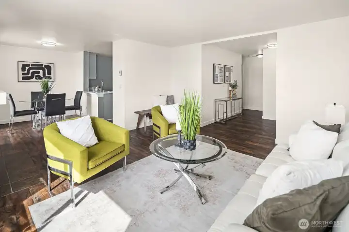 Open concept layout connecting the living and dining areas, highlighting the functional flow and modern style throughout the home. Open concept layout connecting the living and dining areas, highlighting the functional flow and modern style throughout the home.