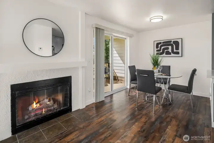 Elegant fireplace with classic white surround and rich hardwood floors, with direct access to the private balcony just beyond. Elegant fireplace with classic white surround and rich hardwood floors, with direct access to the private balcony just beyond.