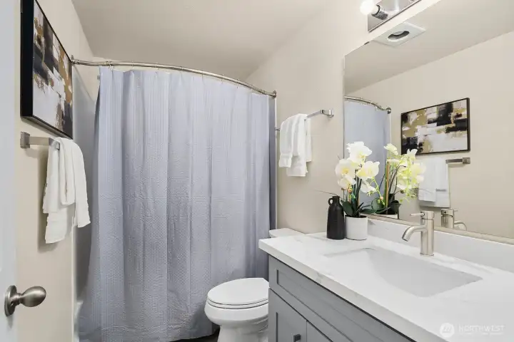 Well-appointed full bathroom featuring updated vanity, modern fixtures, and clean finishes throughout. Well-appointed full bathroom featuring updated vanity, modern fixtures, and clean finishes throughout.