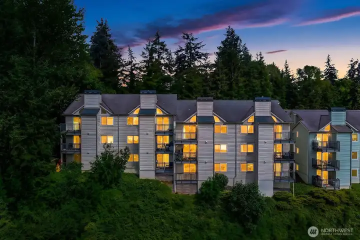 Stunning twilight exterior of Sterling Heights showcasing the building's classic architecture nestled among the lush Pacific Northwest landscape. Stunning twilight exterior of Sterling Heights showcasing the building's classic architecture nestled among the lush Pacific Northwest landscape.