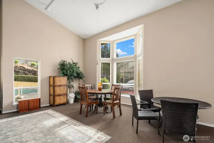 Bright and airy clubhouse lounge featuring vaulted ceilings, large windows, and comfortable seating perfect for relaxing or hosting gatherings. Bright and airy clubhouse lounge featuring vaulted ceilings, large windows, and comfortable seating perfect for relaxing or hosting gatherings.