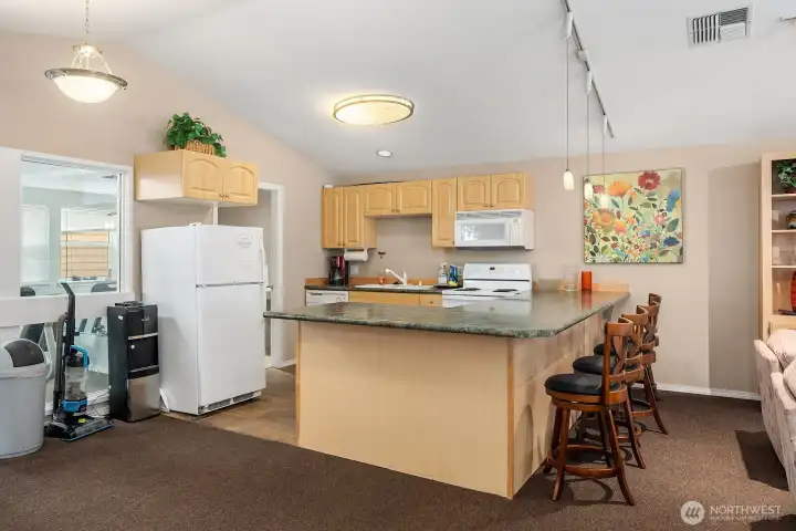 Well-equipped clubhouse kitchen and dining area offering a fully functional space for hosting events and entertaining fellow residents. Well-equipped clubhouse kitchen and dining area offering a fully functional space for hosting events and entertaining fellow residents.