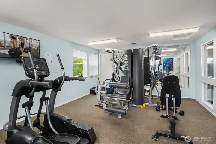 Another view of the well-appointed fitness center showcasing a variety of strength and cardio equipment to support all your wellness goals. Another view of the well-appointed fitness center showcasing a variety of strength and cardio equipment to support all your wellness goals.