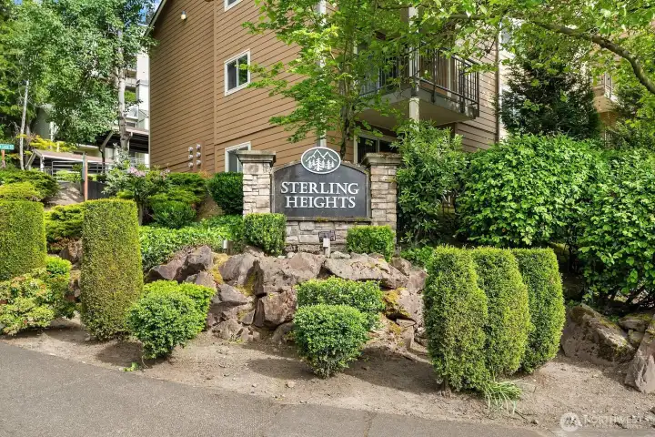 Welcoming Sterling Heights community entrance sign surrounded by mature landscaping and lush greenery, setting the tone for this sought after Factoria community. Welcoming Sterling Heights community entrance sign surrounded by mature landscaping and lush greenery, setting the tone for this sought after Factoria community.