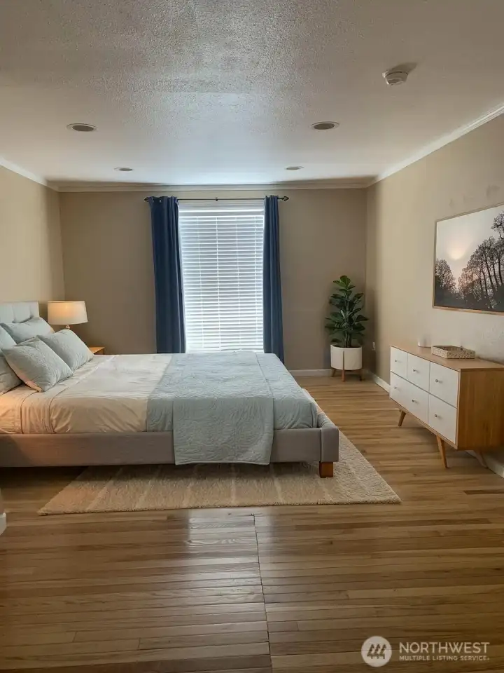 Main floor primary suite with private bathroom. Main floor primary suite with private bathroom.