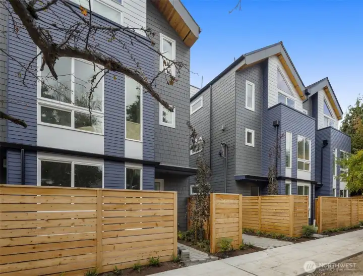 A fenced entry welcomes you home, offering privacy and curb appeal in one of Seattle's most vibrant neighborhoods.
