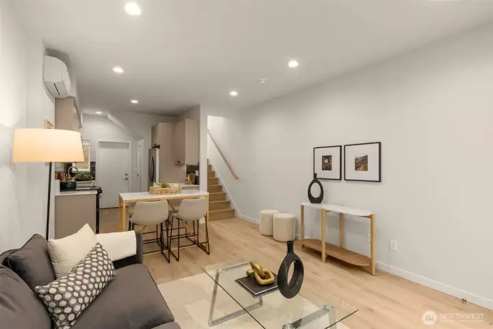 Photos of model home with similar finishes & floor plan. Offering a seamless flow between the living, dining, and kitchen areas. Perfect for hosting or unwinding, this space is made for modern living.
