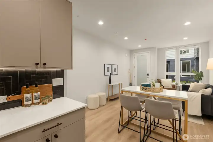 Photos of model home with similar finishes & floor plan. Whether it's a casual meal or a gathering with friends, this layout adapts to your lifestyle.