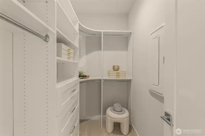 Photos of model home with similar finishes & floor plan. Designed with organization in mind, this spacious walk-in closet offers custom shelving, ample storage, and a dedicated space to keep everything neatly tucked away.