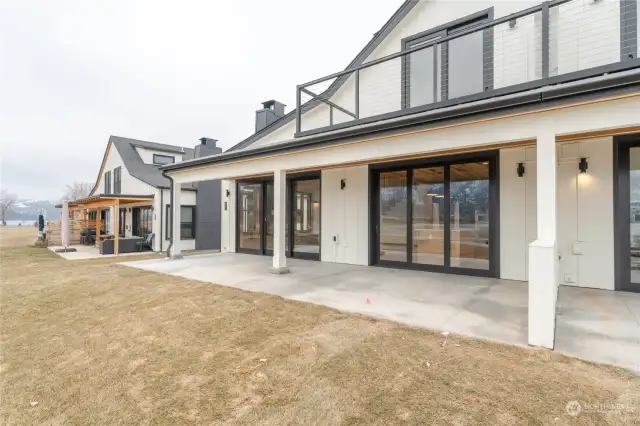 View of home with large patio facing northwest