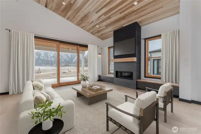 Virtually staged - main floor living area with large nesting sliding doors and fireplace