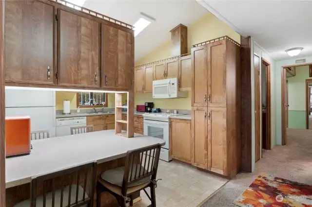 What a fabulous kitchen in which to enjoy cooking! Or if you love outdoor cooking, the expansive covered deck in back is an ideal place to relax and enjoy grilling. And there is a spacious hot tub there too.