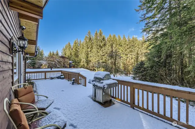 East-facing wrap-around deck—perfect for enjoying breathtaking sunrises, shaded afternoon gatherings, and BBQ entertaining with scenic open-sky views.