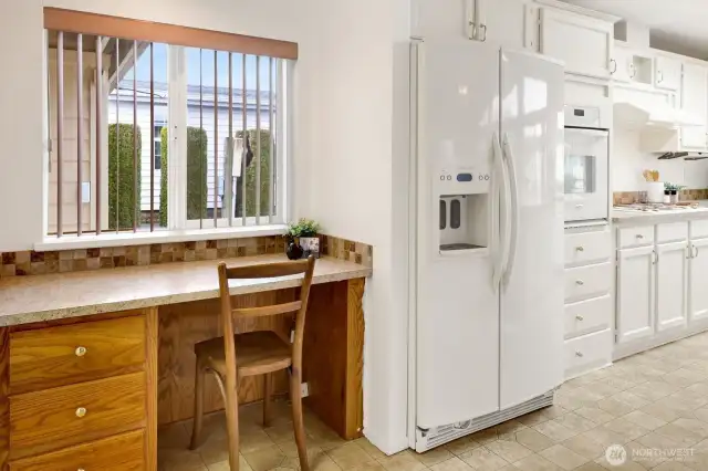 Built-in desk off garage entrance and kitchen.