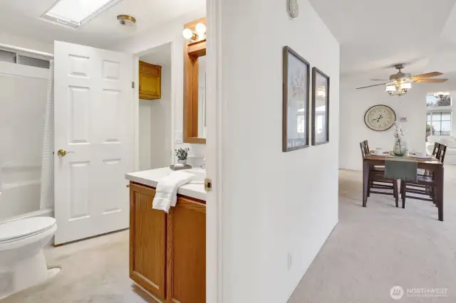 Guest bath in hallway off 1st living room/dining area.