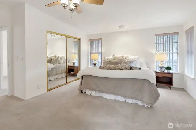 Primary bedroom with walk-in closet and wall closet.