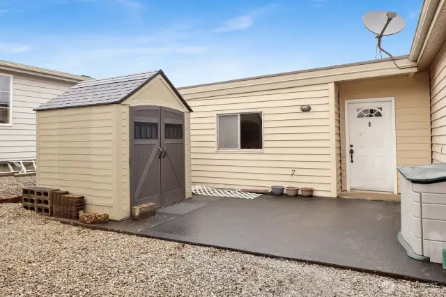 Storage shed in backyard. Door off garage.