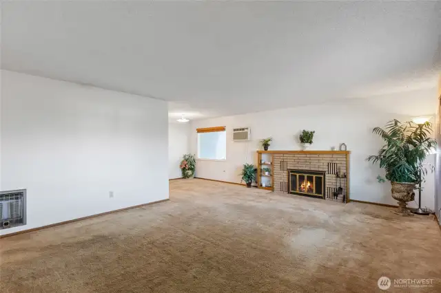Full functioning fireplace in Main level entry, living and dining