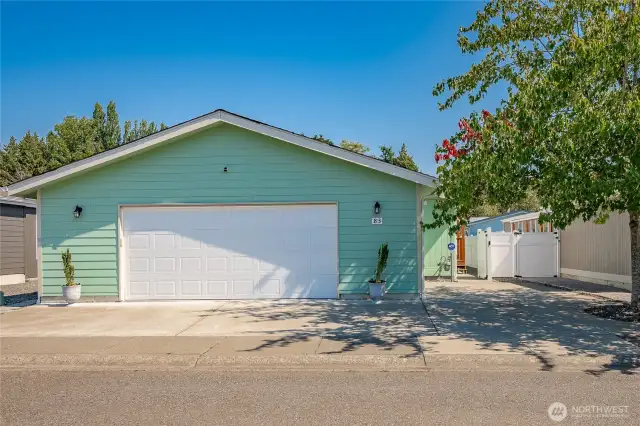 Large 2 car insulated garage and additional parking.
