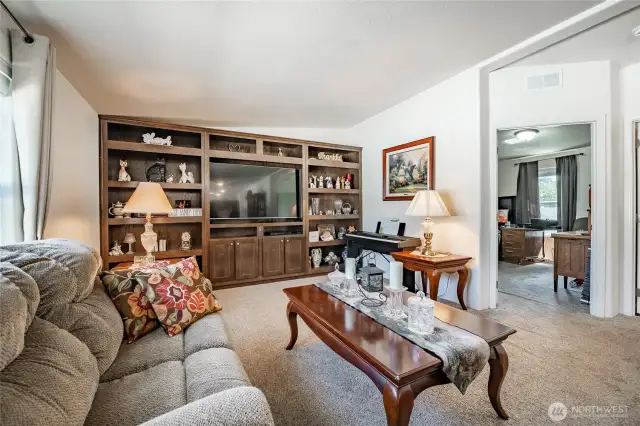 Living Room kitchen behind photographer. 2 Bedrooms and full bathroom to the right.