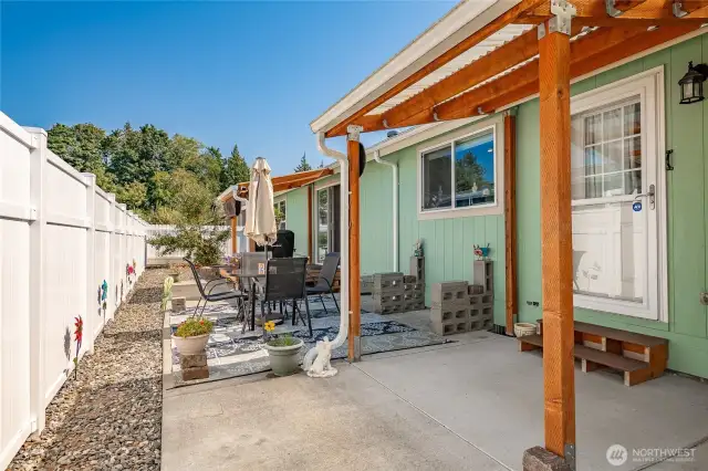 Low maintenance back yard with covered patio and covered deck. Fully fenced all the way around the other side of the home. Apple trees at the back.
