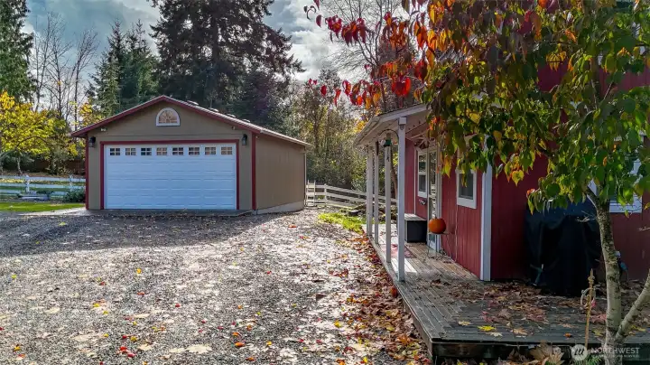 Studio in driveway has 3/4 wrap around deck, feeling like your own tiny home.