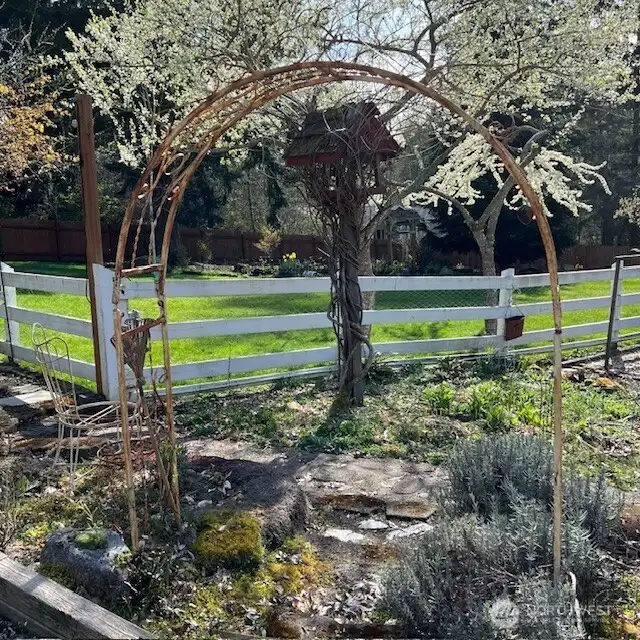 Garden photo from owner with view of fully enclosed, landscaped pasture