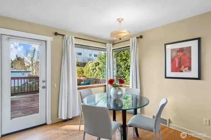 The dining room has access to the large deck and south facing yard.