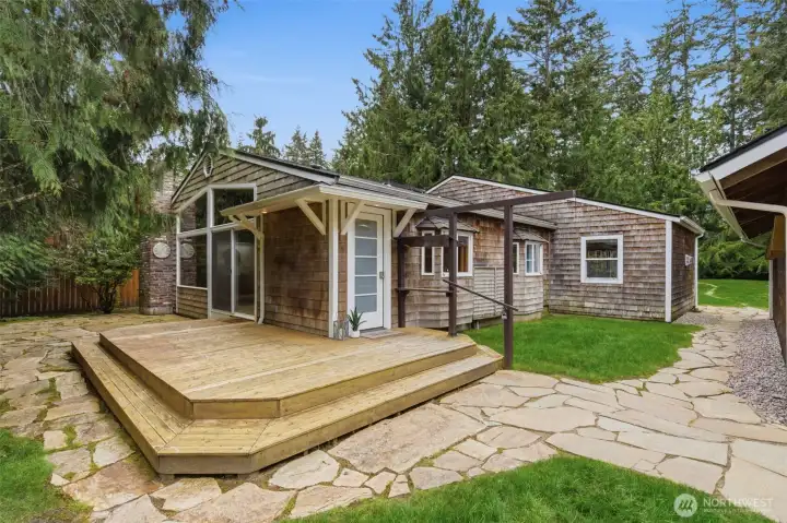 Charming one level living situated in a very private, secluded setting...  close to the Village area in Gig Harbor.  On the right of this photo is an oversized 2-car garage with workshop space.
