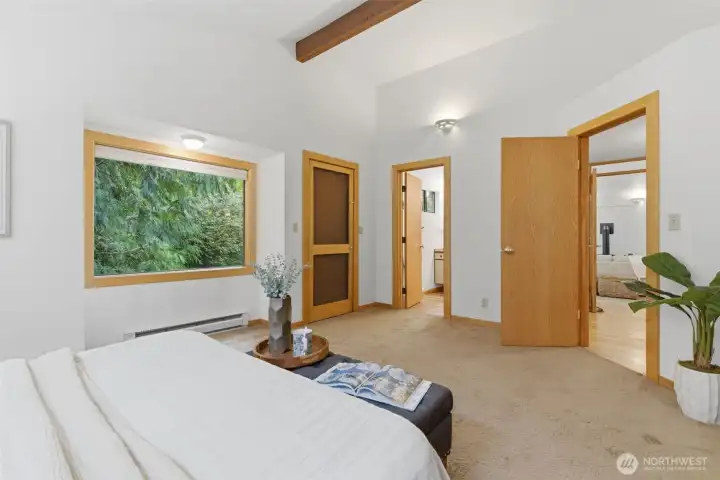 From the Primary, you can access the private back yard and path to the office/crafting/cottage..