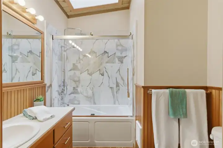 The main bath has a newly installed jacuzzi tub/shower