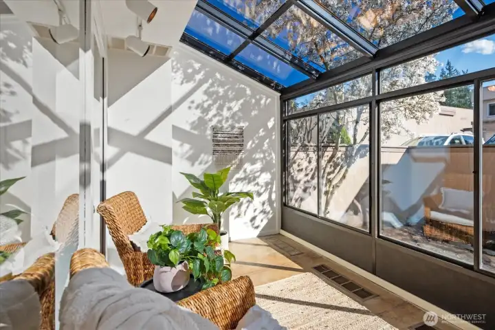 Fabulous sun room looks out onto the private garden