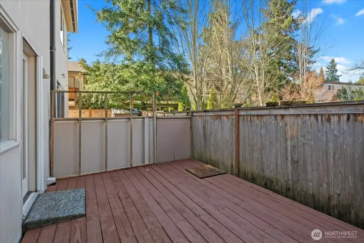 Fully fenced deck in the back of the home